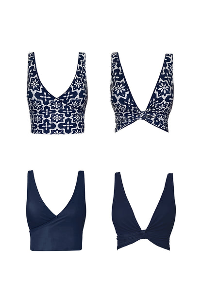 Product image showing each reversible side of the Riad bikini top. One side shows the block midnight navy colour, the other features a striking geometric tile print.