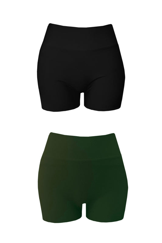 Woman wears a eucalypt coloured swim set with high waisted shorts and a sports bra shaped swim top. The top has thick straps and a black coloured band underneath the bust.