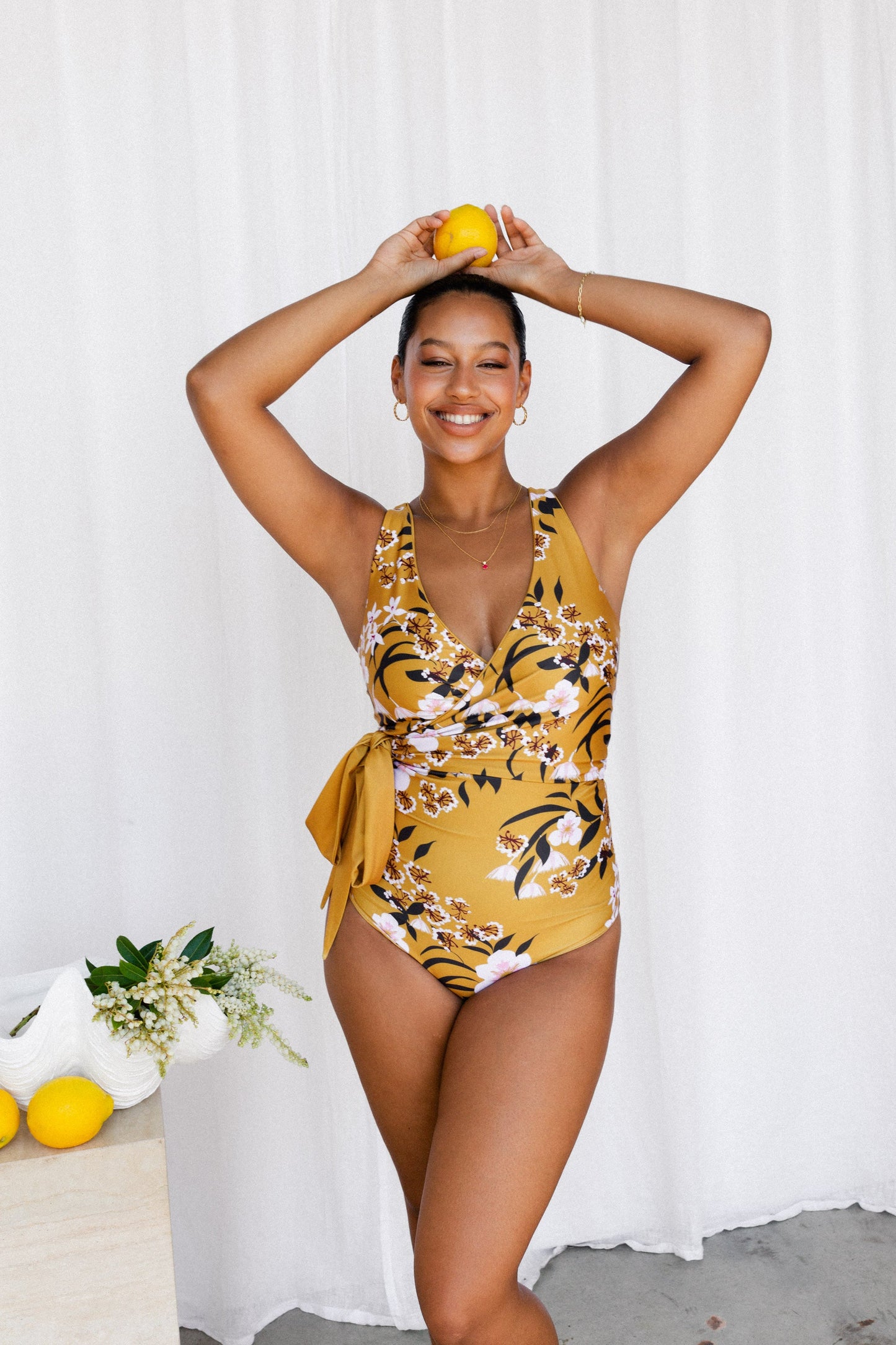 Woman in floral bikini with tie as large bow at waist 