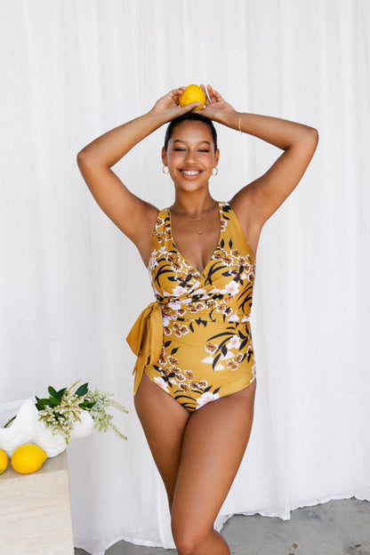 Woman in floral bikini with tie as large bow at waist 