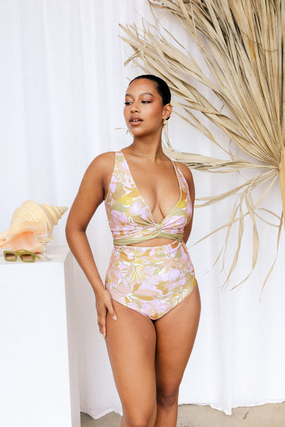 Woman wearing solid floral bikini