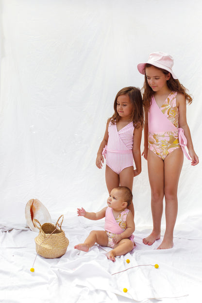 Siblings mix and match in Girl’s reversible swimsuit